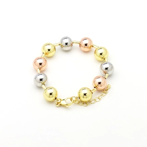 Detailed view of tricolor beaded bracelet with gold, silver and rose gold beads