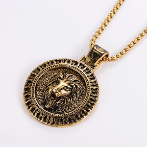 Detailed macro view of vintage lion head pendant necklace with golden sunburst texture