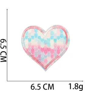 Detail of 6.5cm heart glitter embroidery patch with blue white pink gradient effect