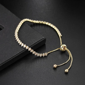 Detail of adjustable gold marquise tennis bracelet with sparkling cubic zirconia crystals