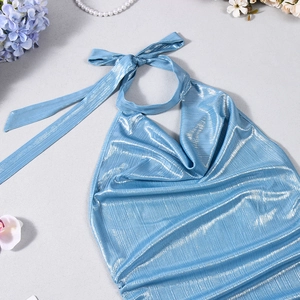 Detail of metallic blue cowl neck top with shimmering pleated texture and halter straps