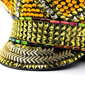 Detailed view of golden rhinestones and metallic rivets on a festive captain hat