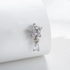Silver star earring with zircon stones and water drop pendant on white display stand