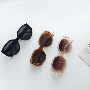 Three-color oversized polygon sunglasses in black, amber, and champagne finishes