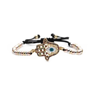 Hamsa-Hand-Armband mit bösem Auge und gold, silber, rotgoldenen Perlen