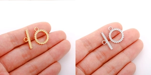 Macro shot of 18k gold and silver wheat pattern OT toggles for DIY jewelry making