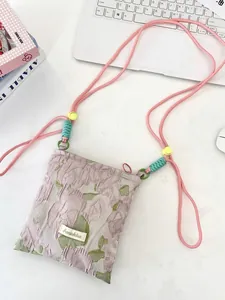 Floral jacquard shoulder bag with pink rope strap and colorful butterfly pattern