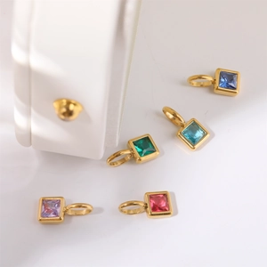 Detail view of five square cubic zirconia pendants in assorted colors with gold frames