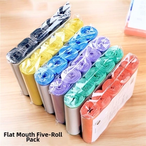 Macro detail of multi-color thickened flat trash bags rolls on a wooden background