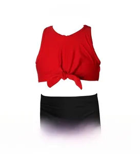Detail of red two-piece girls swimsuit with front knot design and high waist black bottoms