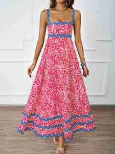Detailed close-up of a pink Bohemian floral maxi dress with blue hem stripes and strap design