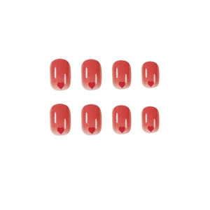 Peach red gradient press-on nails featuring glossy heart designs on a white background