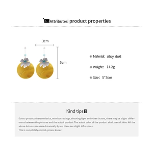 Detailed view of yellow shell flower earrings with alloy accents and size measurements