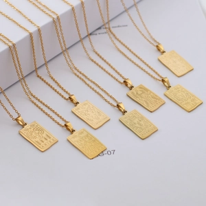 Detailed view of rectangular gold-plated stainless steel zodiac sign pendant necklaces