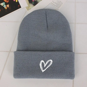 Unisex grey knitted beanie hat with white heart embroidery for winter warmth