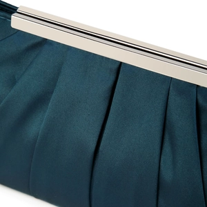 Detail of teal pleated satin evening clutch with elegant silver metal frame closure