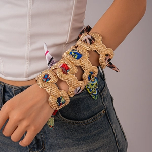 Bohemian wide hollow metal cuff with colorful silk ribbon weave and gold finish