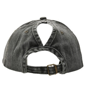 Detail view of washed cotton ponytail baseball cap with functional back opening and buckle