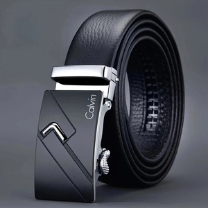 Close-up of black leather belt with silver automatic buckle and engraved Calvin logo