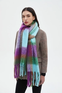Detail of soft thick checkered scarf with long tassels in purple and turquoise colors