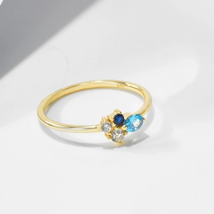 Macro detail of gold plated 925 silver ring with colorful zircon stones and 925 stamp