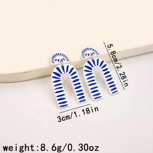 Detail showing blue and white porcelain pattern earrings with precise dimension measurements
