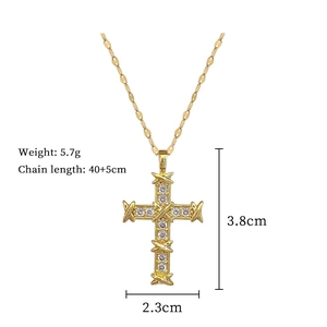 Detailed view of gold cross necklace with crystal X-design and specific dimensions