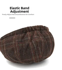 Detail of the elastic band adjustment on a dark brown plaid wool newsboy cap