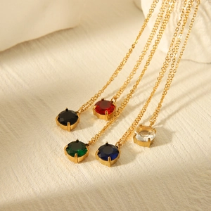 Elegant stainless steel gold chains with round colorful gemstone pendants in five vibrant shades