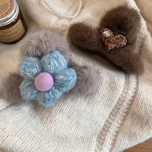 Winter plush hair claw clip featuring knit flowers and leopard heart patterns for women