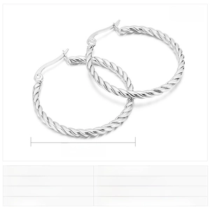 Macro shot of silver stainless steel twisted hoop earrings showing 30mm diameter dimensions