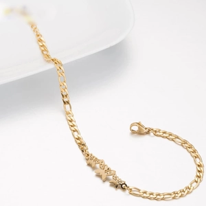 Elegant gold titanium steel Figaro chain bracelet featuring delicate hollow butterfly pendants