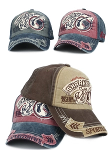 Detail of vintage washed cotton baseball cap with 3D shark embroidery and distressed edges
