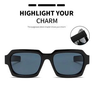Detail view of stylish black geometric sunglasses with thick temples and dark UV lenses