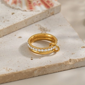 Double-layer 18K gold-plated titanium ring with cubic zirconia and a small charm