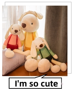 Detailed plush bunnies in pastel yellow pink and green wearing striped overalls