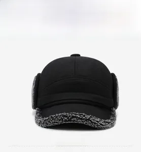 Detail of wool baseball cap featuring thick faux shearling lining and folding ear flaps