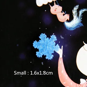 Small 1.6x1.8cm translucent ice blue resin snowflake charm with fine glitter detail