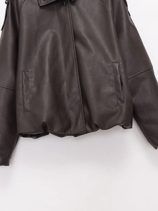 Flat lay of a dark brown faux leather jacket featuring lapels and a smooth texture