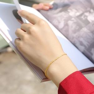 Close-up of sparkling gold S925 silver bracelet with sandblasted texture on a model wrist