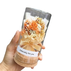 Mini glass wishing bottle with dried orange flowers and cork lid for gift decoration