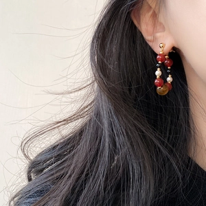 Retro hoop earrings featuring tiger eye stone and pearls on a silver needle stud
