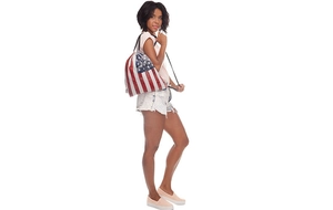 Model wearing American flag drawstring backpack showing size and vintage street style look