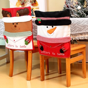 Detail of Christmas chair covers featuring 3D reindeer and snowman with festive embroidery