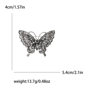 Vintage silver butterfly brooch with grey rhinestones, dimensions 5.4cm by 4cm