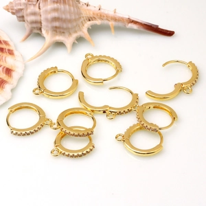 Macro detail of 18k gold plated earring hooks with cubic zirconia for DIY jewelry making