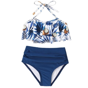 Two-piece girls swimsuit with tropical leaf print ruffle top and navy high waist bottoms