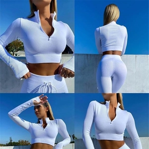 Detailed views of a white ribbed knit tracksuit with a long sleeve crop top and drawstring pants