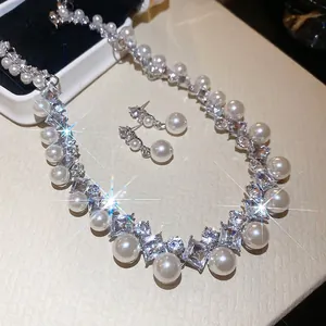 Elegant diamond-set diamond pearl necklace and earring set with vintage French design