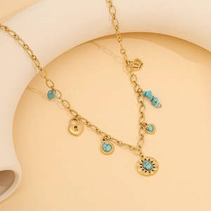 Vintage turquoise heart pendant necklace with gold beaded chain and crown charms
